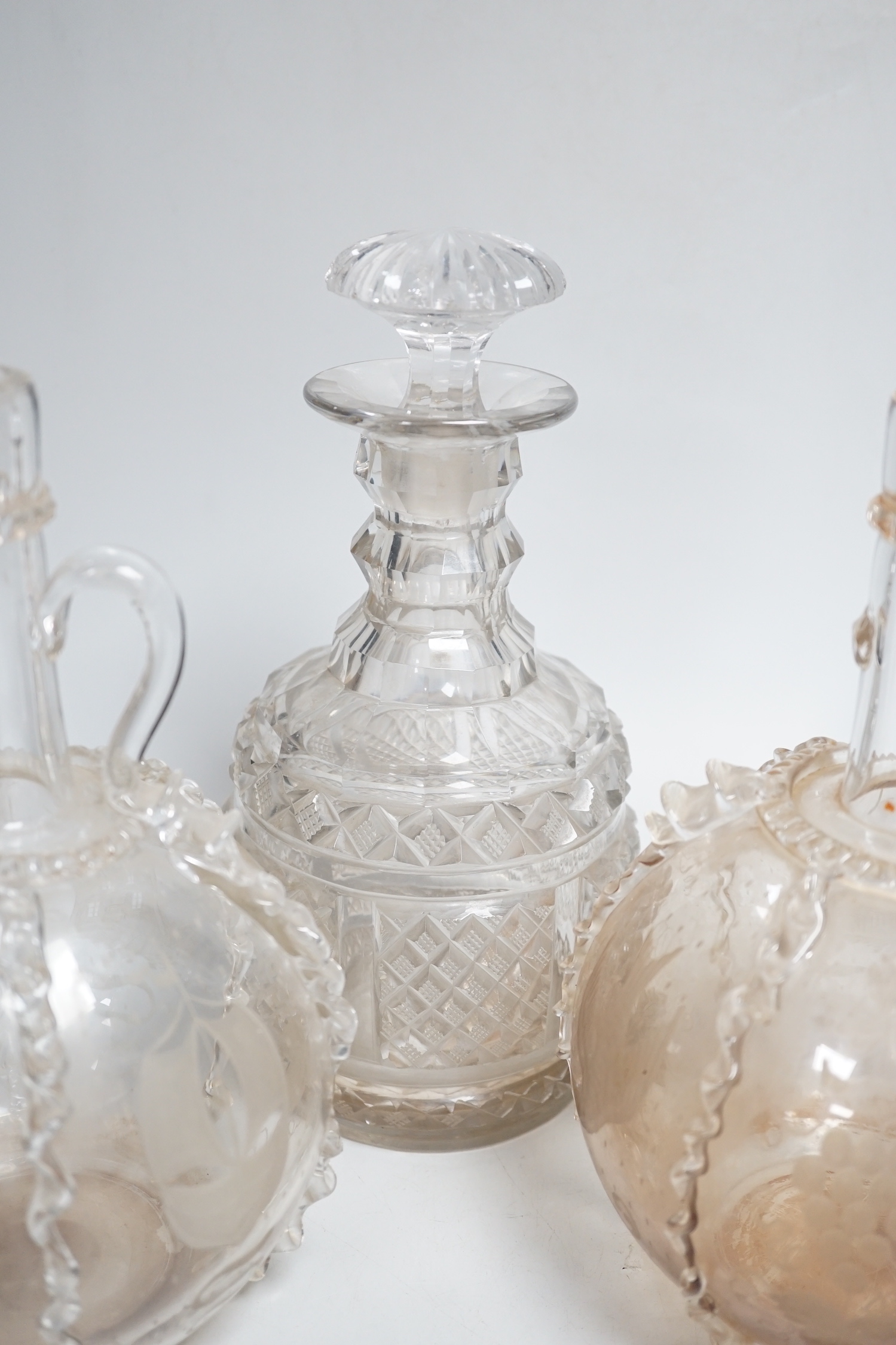 Two Dutch wheel engraved glass flasks and two Regency cut glass decanters, flasks 23cm high (4)